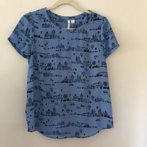 Light blue cityscape blouse